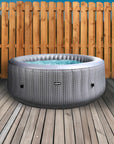 Insulated Hot Tub Mat On a Deck With a Wave Spa Hot Tub And Fence In The Background
