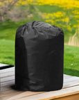 Insulated Pump Cover For Egg Pump Inside a Black Trash Bag On a Wooden Table