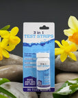 Bottle Of Water And Flowers Next To 3 In 1 Pool And Spa Dip Test Strips For Water Quality