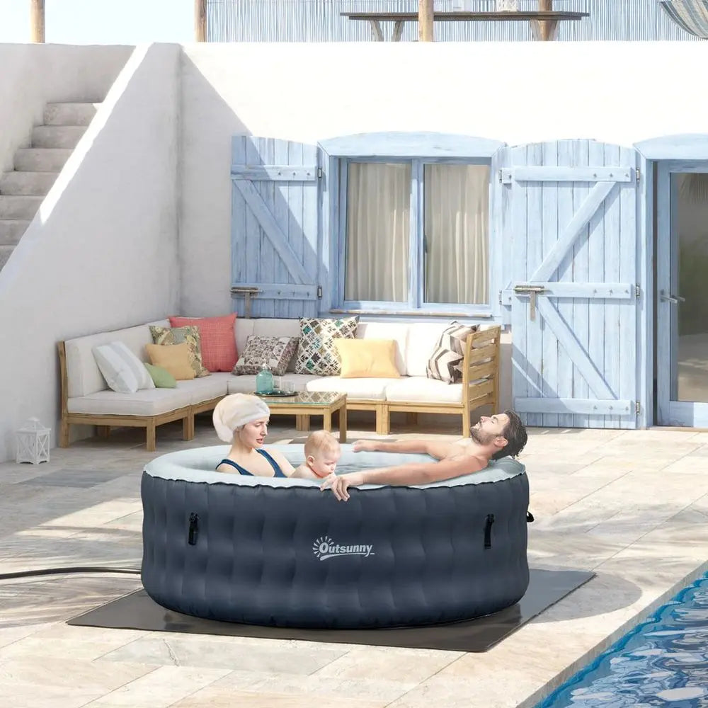 A Woman Relaxing In An Inflatable Hot Tub Bubble Spa For 4 People, Dark Blue Round