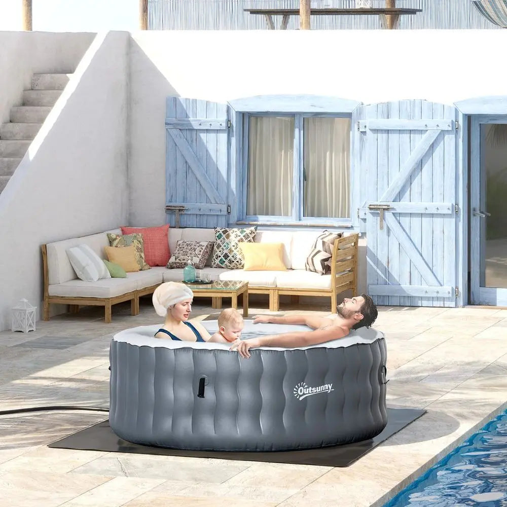 Woman Relaxing In a Light Grey Inflatable Hot Tub Spa, Perfect For Four-person Comfort