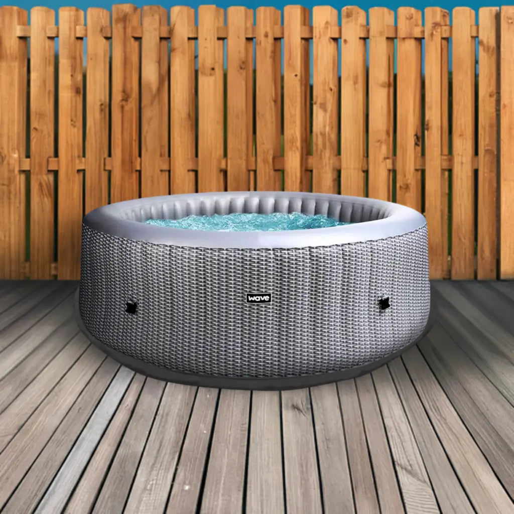 Insulated Hot Tub Mat On a Deck With a Wave Spa Hot Tub And Fence In The Background