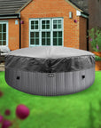 Grey Round Patio Table Cover For Wave Spa Atlantic Hot Tubs On a Green Lawn