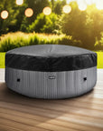 Round Dog Bed On a Wooden Deck Beside An Insulated Lid For Wave Spa Atlantic Hot Tubs