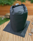 Insulated Pump Cover: a Black Bag On a Wooden Deck For Cosy Spa Smart Pump Protection