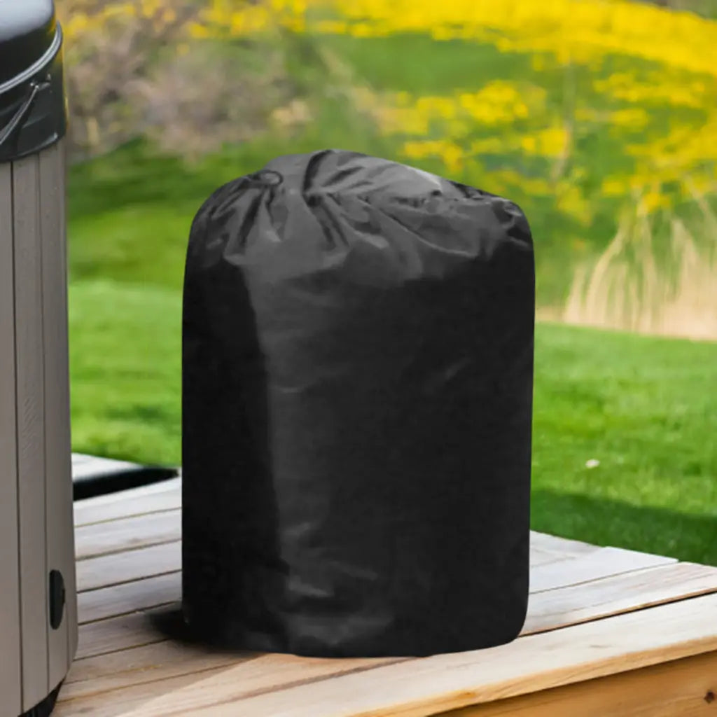 Insulated Pump Cover For Egg Pump Inside a Black Trash Bag On a Wooden Table