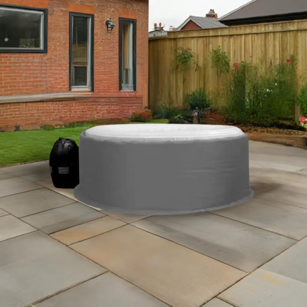 Inflatable Hot Tub With Gray Cover And Insulated Jacket On Patio By Canadian Spa