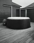 Inflatable Hot Tub On Wooden Deck With Insulated Jacket By Canadian Spa For Added Warmth