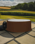 Round Hot Tub With White Interior On Patio, Shielded By Insulated Hot Tub Jacket For Cleverspa