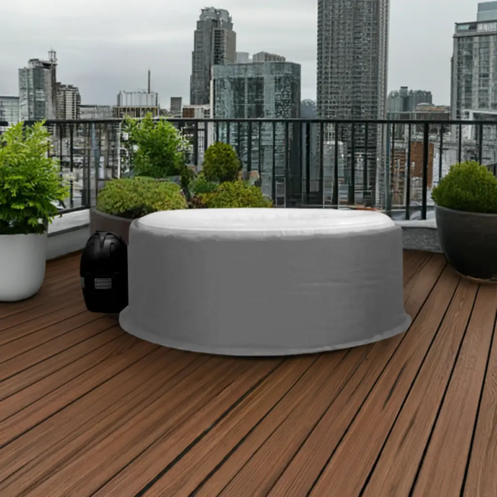 Circular White Intex Purespa Bubble Hot Tub On Wooden Deck With An Insulated Jacket