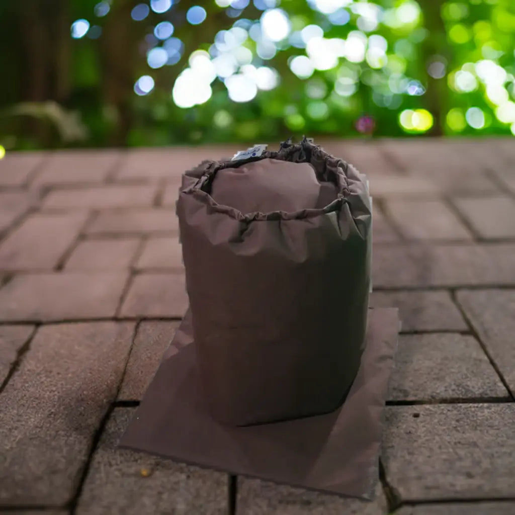 Insulated Pump Cover For Lay-z Spa Hydrojet 2021 Seen On The Ground Near a Hot Tub