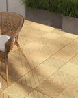 A Patio With a Chair And a Table On Outsunny Interlocking Flooring Tiles, Ideal For Hot Tubs