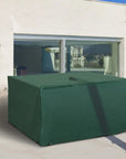 A Large Green Rain Protective Cover For Your Outdoor Rattan Furniture On a Patio