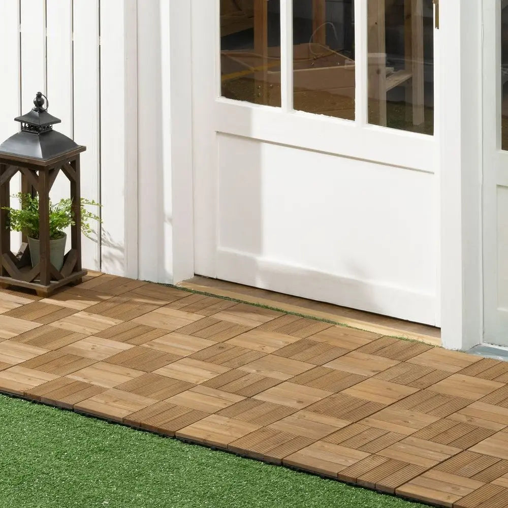 Durable Interlocking Decking Tiles With Lantern On Wooden Deck And Lush Green Grass